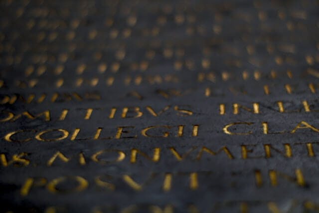 a close up of a metal surface with writing on it